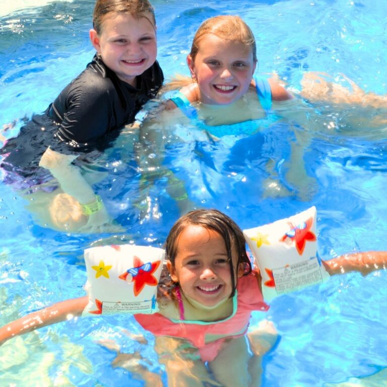 Kids floating in pool