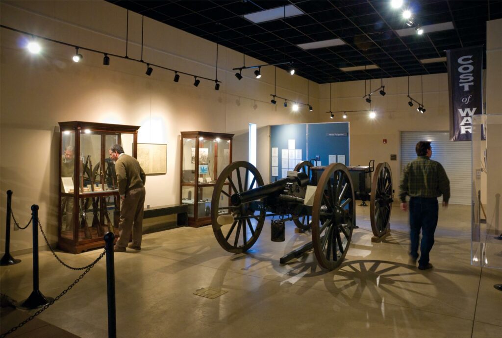 Museum interior with Civil War cannon and artifacts.